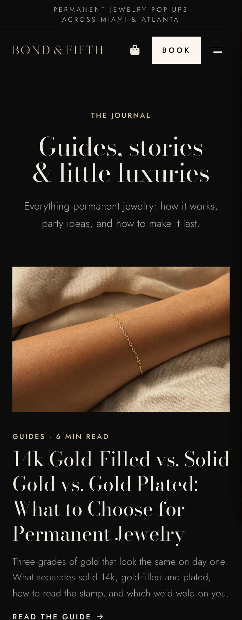 The Journal on a phone: Guides, stories and little luxuries, then a guide comparing gold-filled, solid gold and gold-plated permanent jewelry.