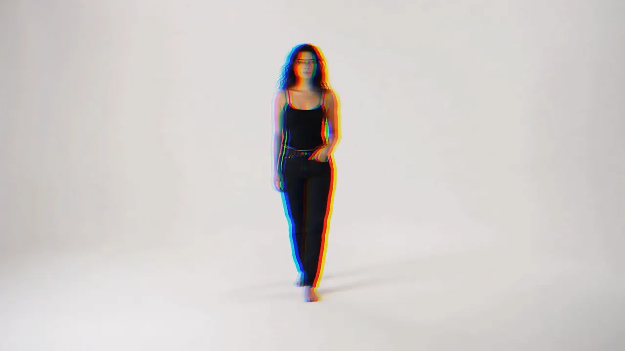 Lucia standing alone in a bright white studio